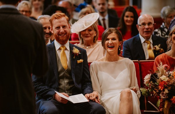 bride and groom laughing