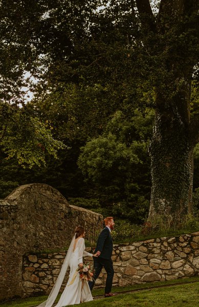 bride and groom trees outside