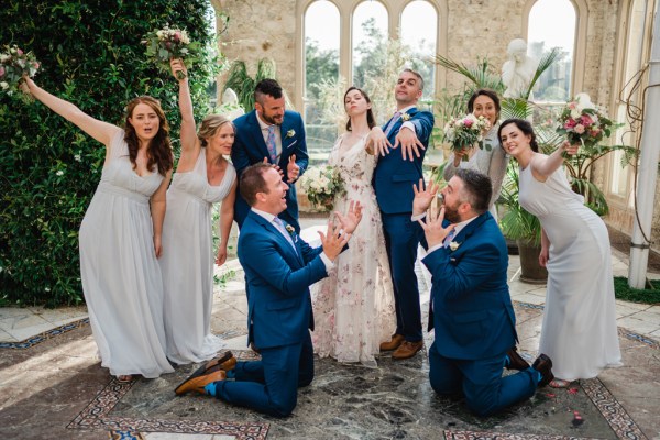 Wedding photography Jane & Alex showing off rings bridesmaids bridesmen interior shot flowers