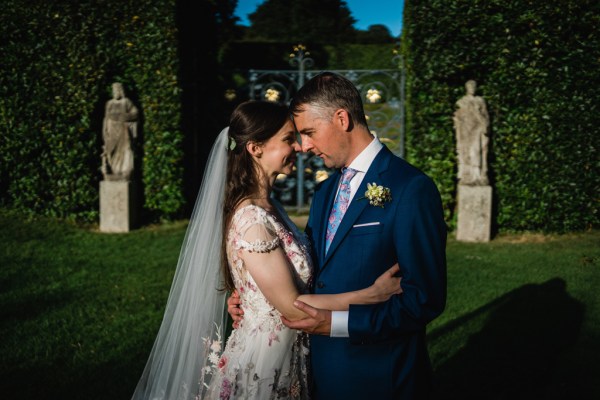 Wedding photography Jane & Alex exterior couple hotel photography summer dress detail gate embrace hug