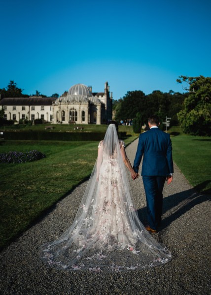 Wedding photography Jane & Alex couple exterior photography shot bride and groom veil train hotel