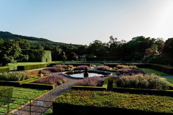 Wedding photography Jane & Alex exterior garden shot fountain