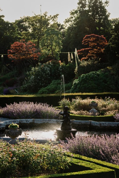 Wedding photography Jane & Alex exterior garden shot fountain