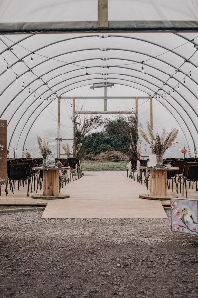 Aisling & Forbes Real Wedding marquee interior shot flowers lights