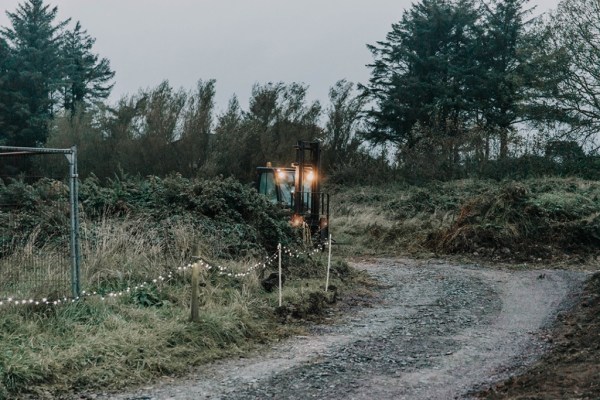 Aisling & Forbes Real Wedding tractor farm lights exterior