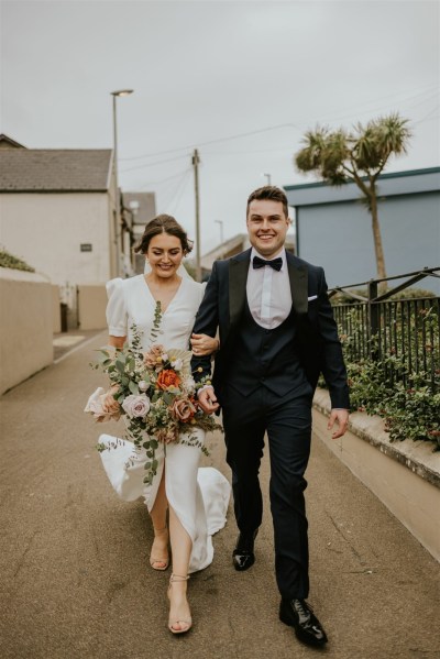 Bride groom suit and tie photography after ceremony bouquet flowers roses