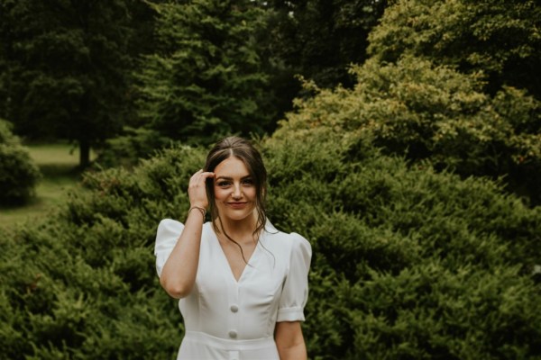 Smiling bride to camera forest detail in background hair