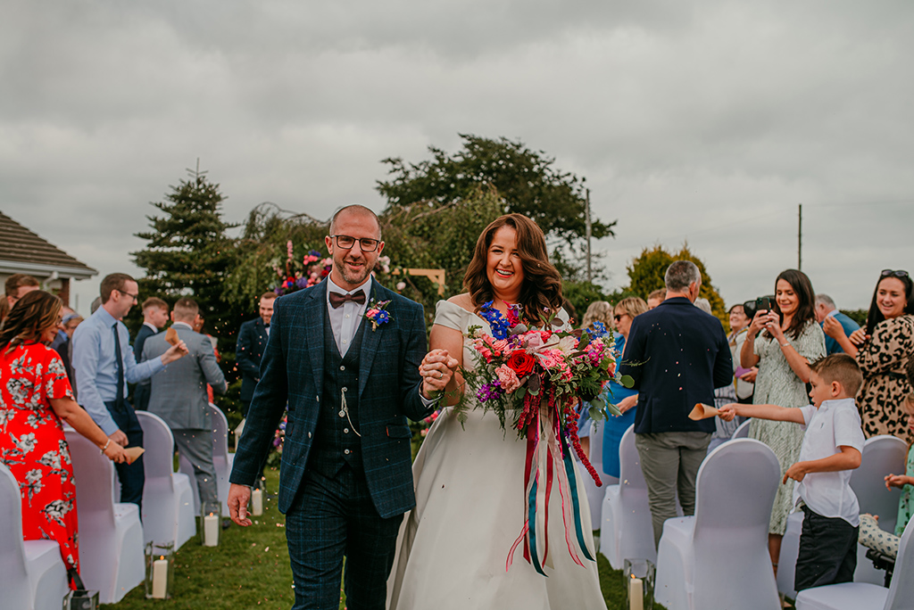 Bridin & Michael Real Wedding ceremony bride groom wedded couple clapping family