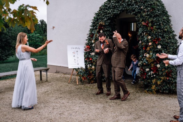 Micháel & Anrzej Real Wedding confetti after ceremony family friends flowers