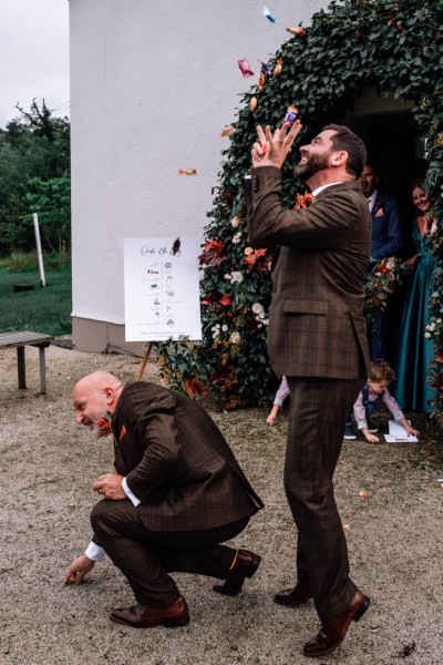 Micháel & Anrzej Real Wedding confetti after ceremony family friends flowers smiling