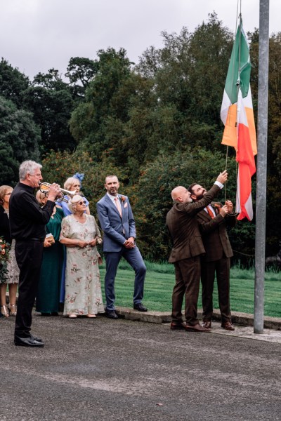 Micháel & Anrzej Real Wedding after ceremony family friends flag Ireland trumpet player music