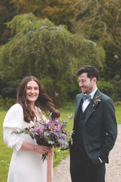 Juniper Barn Photography real weddings bride groom exterior laughing flowers