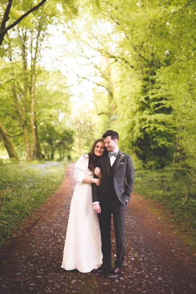 Juniper Barn Photography real weddings bride groom hug exterior shot