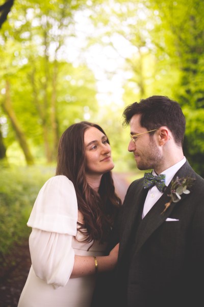 Juniper Barn Photography real weddings bride groom hug exterior shot embrace