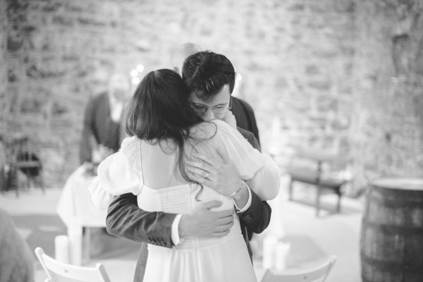 Juniper Barn Photography real weddings bride groom ceremony hug embrace