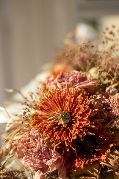 Real Wedding: Tracey & Ultan close up ring green emerald flower detail photography