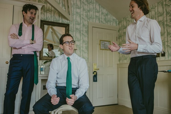 Groomsmen groom best man interior laughing smiling