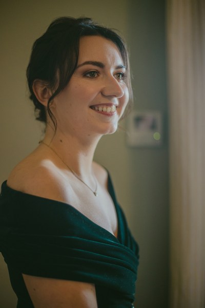 Bridesmaid green dress smiling