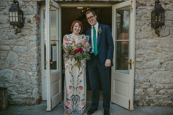 Bride and groom roses bouquet of flowers cheers prosecco and champagne exterior