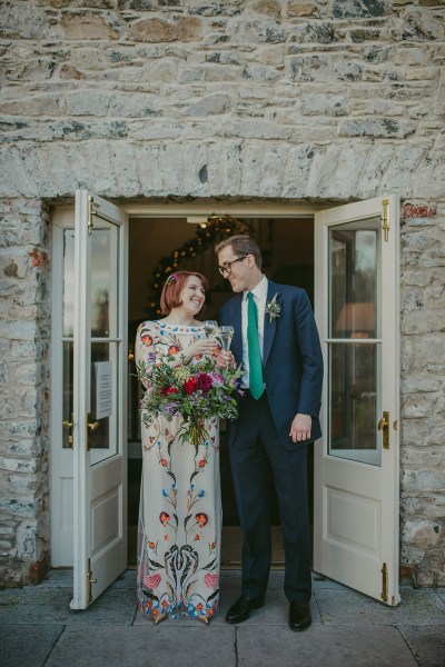 Bride and groom roses bouquet of flowers cheers prosecco and champagne