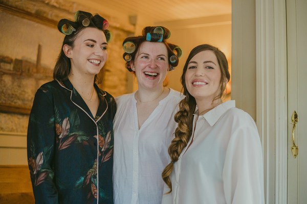 Emotional bride bridesmaids curler roller hair smiling laughing crying