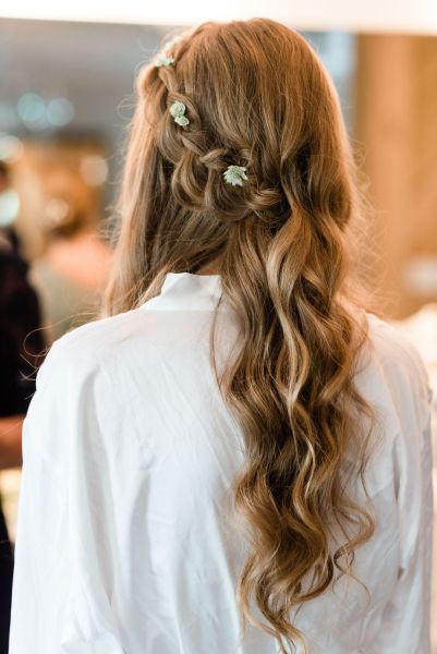 Close up of bridal hair flowers wavy getting ready