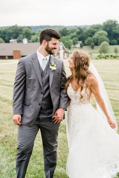 Couple looking at each other lovingly exterior farm dress detail veil exterior shot