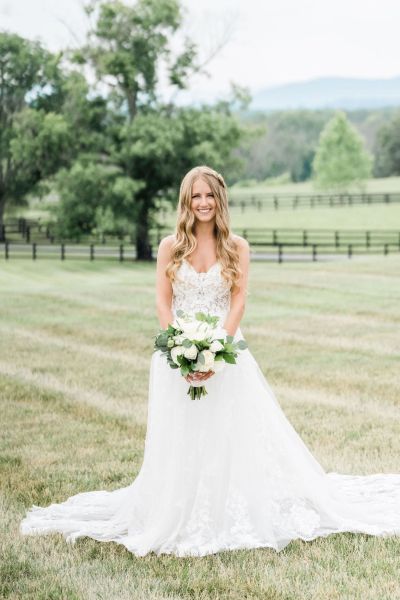 Bride lace dress white bouquet of flowers exterior farm tree hair detail