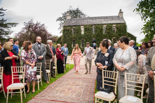 Eoin & Darran Real Wedding friends family walking down aisle guests ceremony exterior