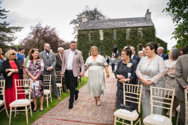 Eoin & Darran Real Wedding couple walking down aisle exterior shot guests