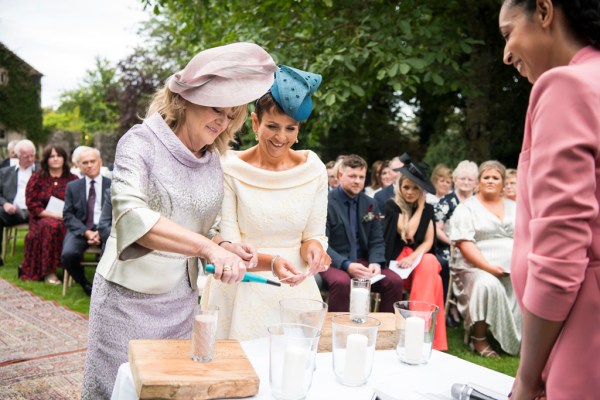 Eoin & Darran Real Wedding mothers lighting candle hat dress officiant officiate guests ceremony