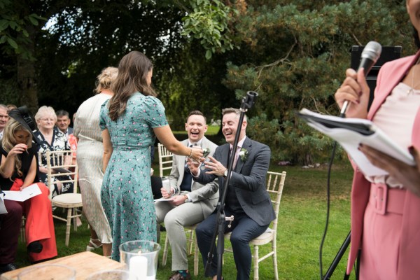 Eoin & Darran Real Wedding happy smiling candle grooms ceremony guests officiate officiant mic