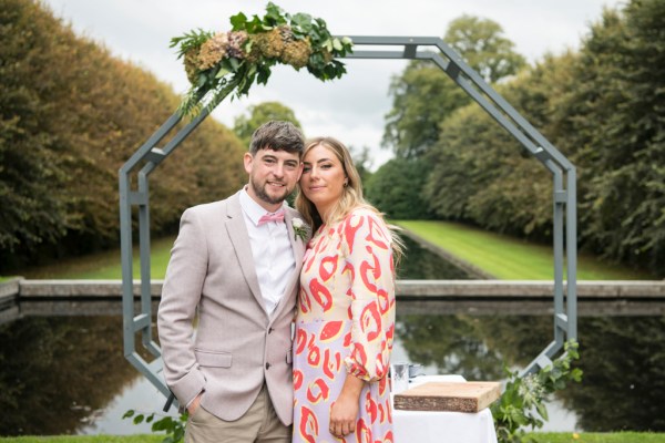 Eoin & Darran Real Wedding couple lively smiling to camera exterior shot dress