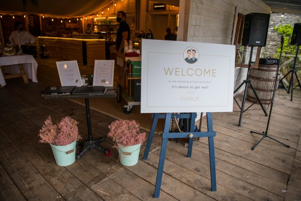 Eoin & Darran Real Wedding welcome sign exterior flowers bar dining music