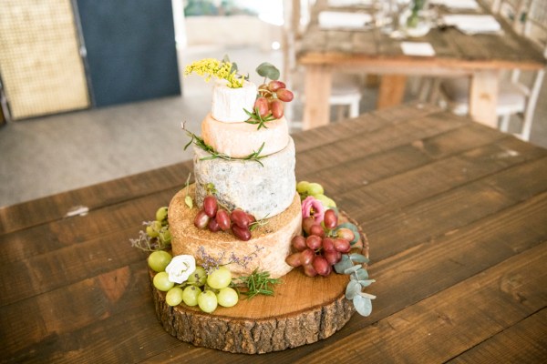 Eoin & Darran Real Wedding flowers roses ribbon interior tent shot grape cheese wooden board cheeseboard