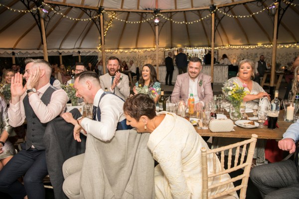 Eoin & Darran Real Wedding guests happy laughing smiling interior tent dining