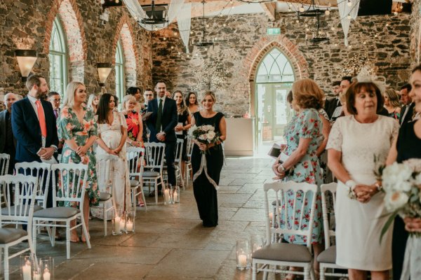 bridesmaid walking up aisle