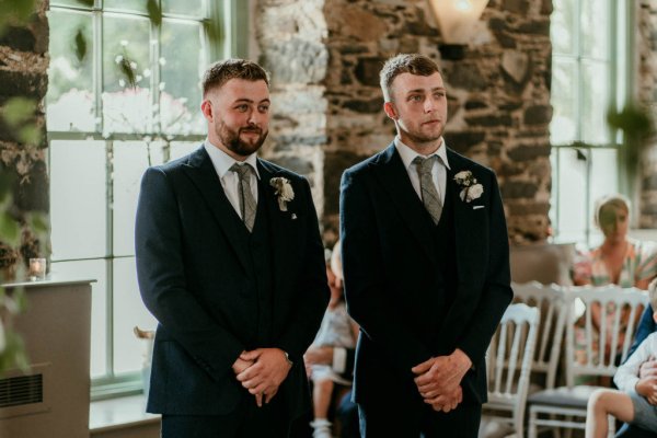 groomsmen at ceremony altar