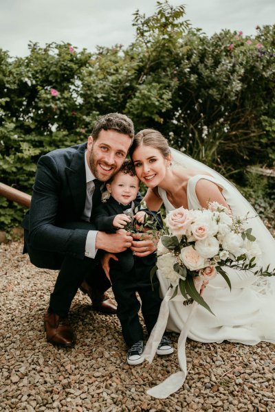 bride and groom with baby son