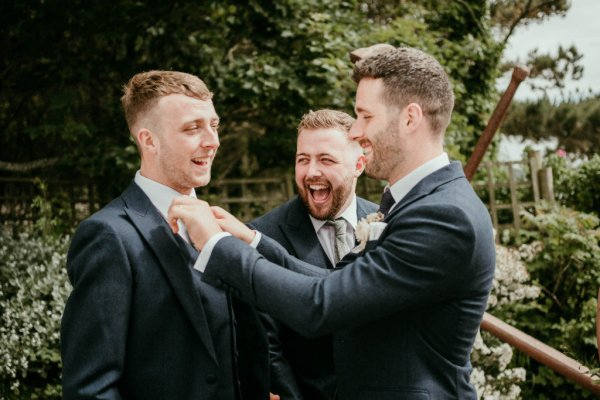 groomsmen laughing