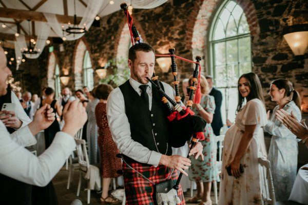 pipe band in kilt wedding entrance