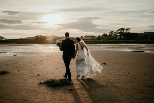 bride and groom on beach