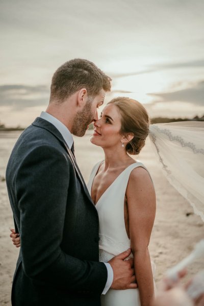 bride and groom on beach