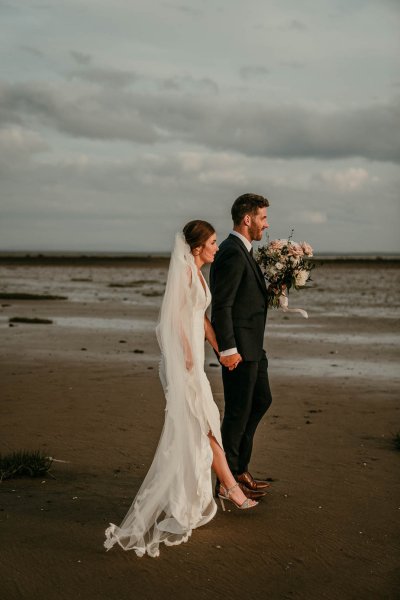 bride and groom on beach