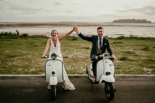 bride and groom on vespas