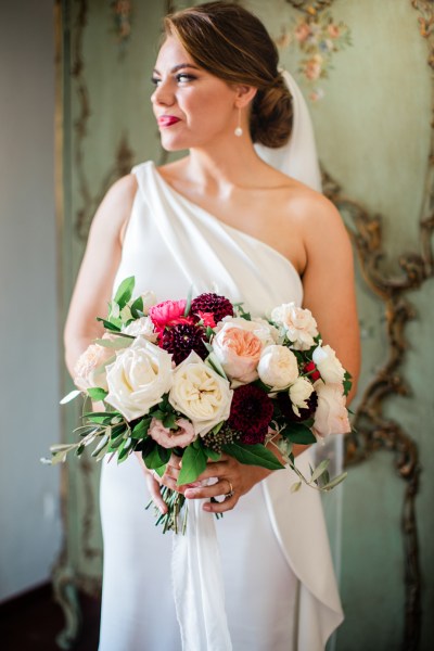 Bride holding bouquet flowers roses