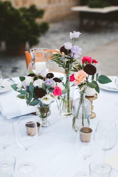 Close-up rose flower detail on dining table champagne wine glasses