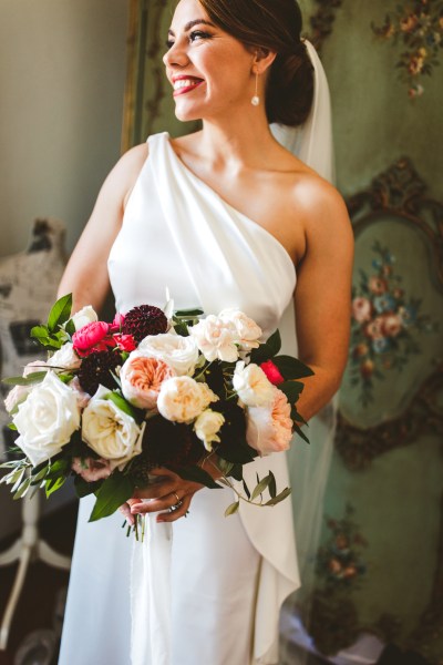 Bride flowers looking away bouquet interior getting ready ceremony