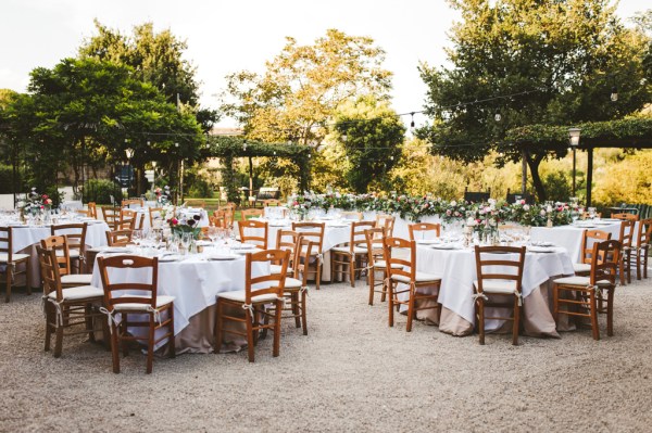 Exterior dining chairs table food flowers setting