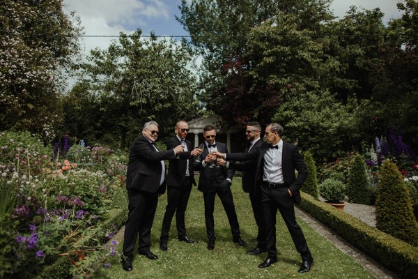 Cheers groom best man groomsmen sunny smiling exterior champange prosecco